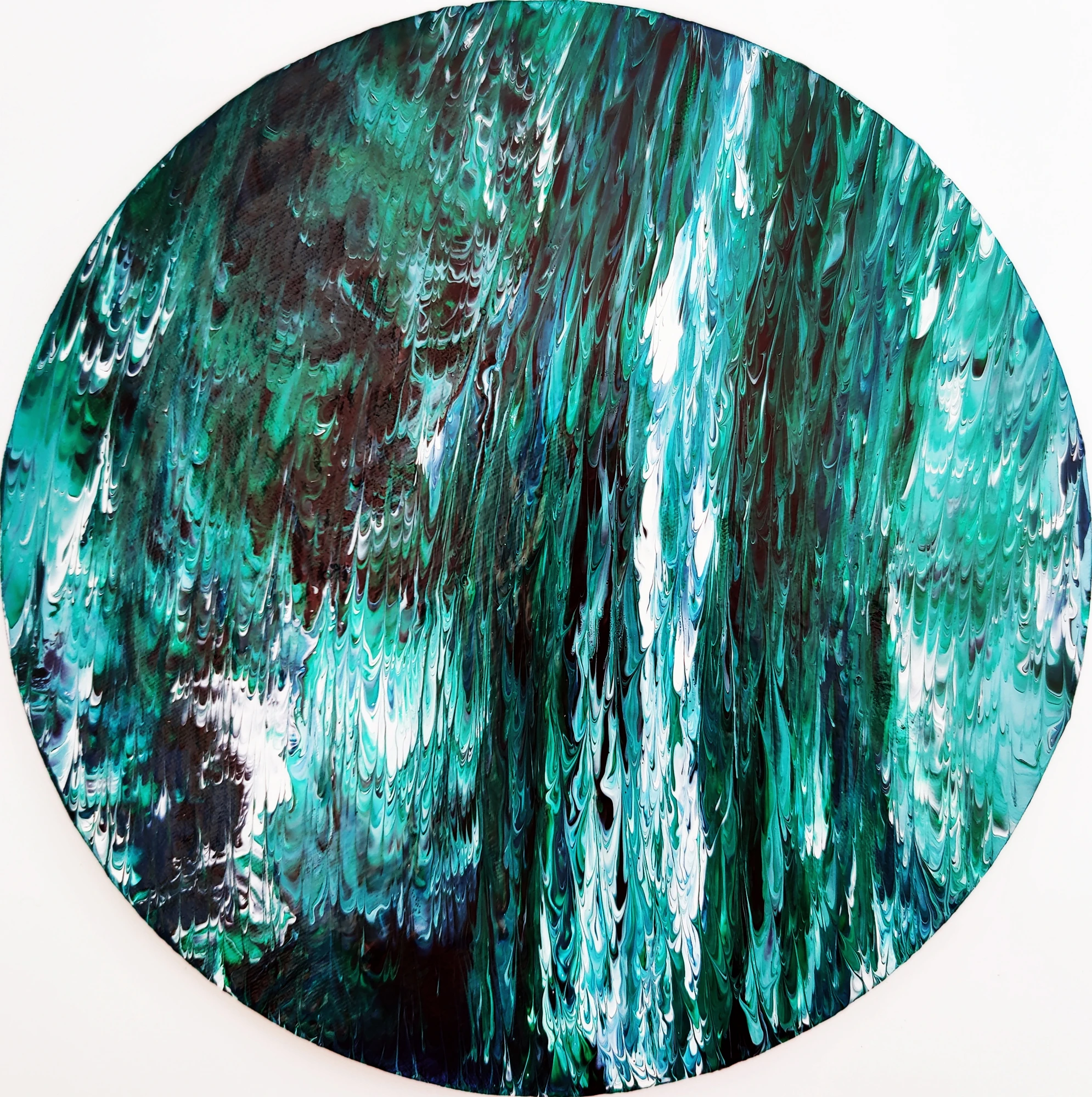 Vertical traces of green, black and white held within a circular canvas.